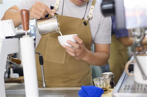 Barista making hot latte art in coffee shop 5137575 Stock Photo at Vecteezy