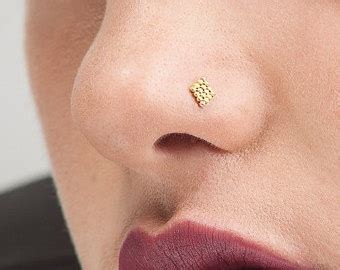 9 New & Stylish Designer Nose Pin Designs for Womens