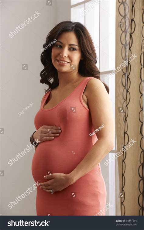 Beautiful Expecting Mother At Six Months Pregnant Holding Belly In ...