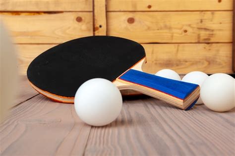 Premium Photo | Ping pong equipment on wooden table close up