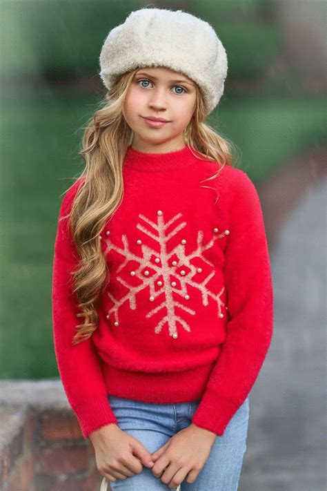 Keep it merry and bright with our sweet girl's sweater this winter season! Fuzzy, festive, and ...
