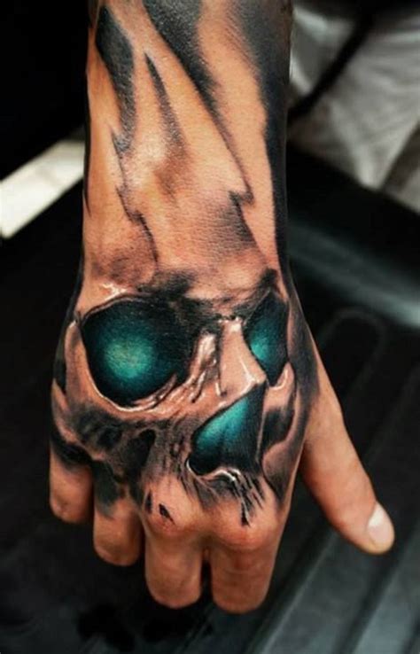 Hand Skull Tattoo | Wrist tattoos for guys, Hand tattoos for guys, Skull hand tattoo