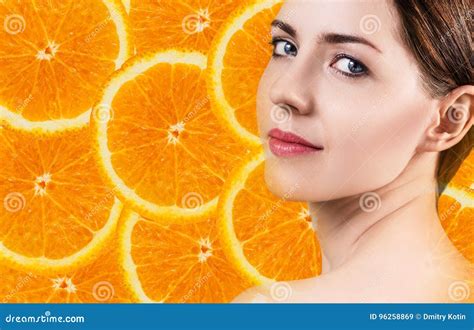 Young Woman Over Orange Fruit Slices Background. Stock Image - Image of heap, closeup: 96258869