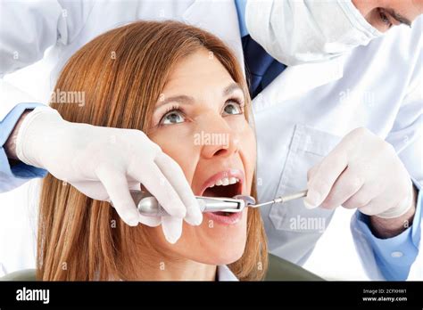 Pulling teeth at the dentist with pliers Stock Photo - Alamy