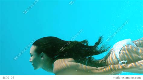 Woman Swimming Underwater Stock video footage | 4620106