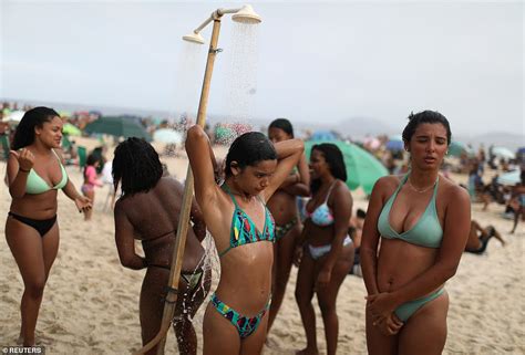 Thousands pack on to beaches in Rio de Janeiro despite Brazil suffering ...