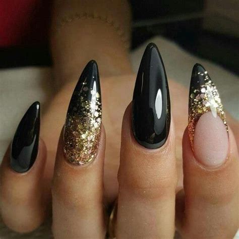 Black and gold stiletto nails art #stilettonails | Stiletto nails designs, Gold stiletto nails ...