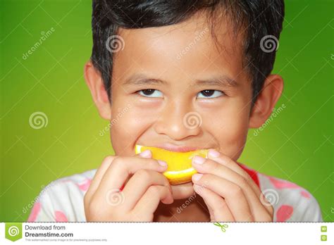 Eating Orange Fruit stock image. Image of sweet, food - 72085755