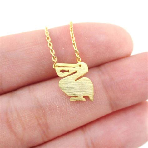 Pelican with Fish Cut Out Silhouette Shaped Charm Necklace in Gold – DOTOLY