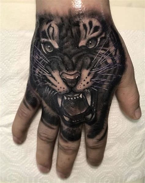 Pin by 4paws on Tattoos | Lion hand tattoo, Lion hand tattoo men, Tiger hand tattoo