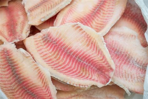 Premium Photo | Fresh frozen fillets of tilapia fish