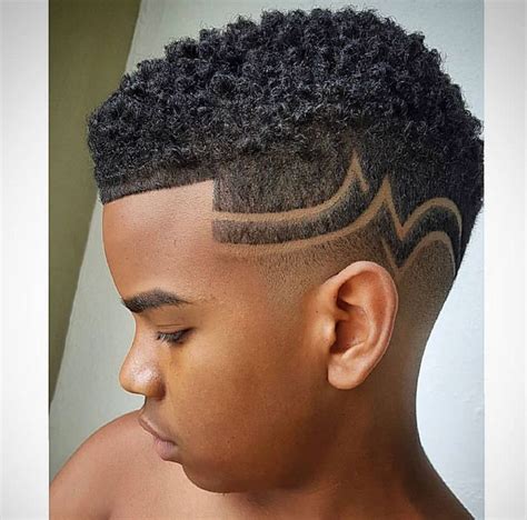 L’image contient peut-être : 1 personne, gros plan | Shaved hair designs, Hair designs for boys ...