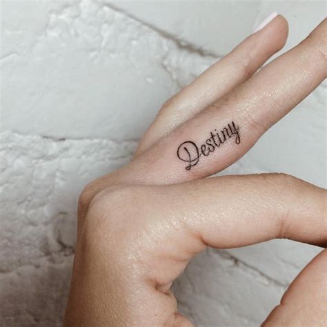 Hand poked word destiny - Tattoogrid.net