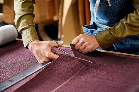 "Worker Cutting Fabric With Scissors In Sofa Workshop" by Stocksy Contributor "ALTO IMAGES ...