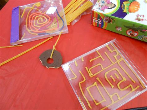CD case mazes using Bend-a-roos (wax-covered string), empty CD cases, duct tape, a BB pellet ...