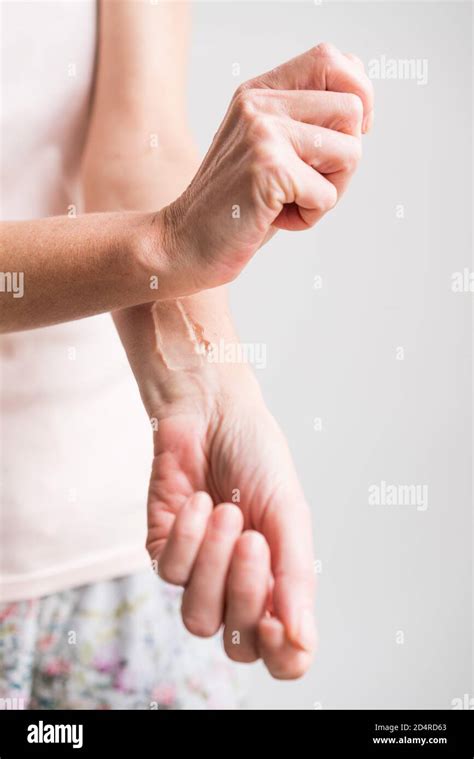 Woman applying estrogen gel on hi-res stock photography and images - Alamy