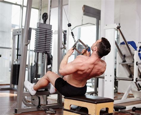 Workout at cable machine — Stock Photo © Xalanx #45031991