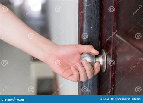 Hand is Opening the Door Knob Stock Photo - Image of hotel, handle: 138557864