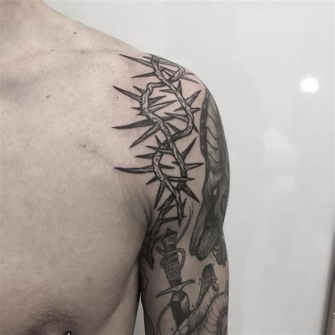 Crown of thorns tattoo on the left shoulder | Thorn tattoo, Tattoos, Cage tattoos