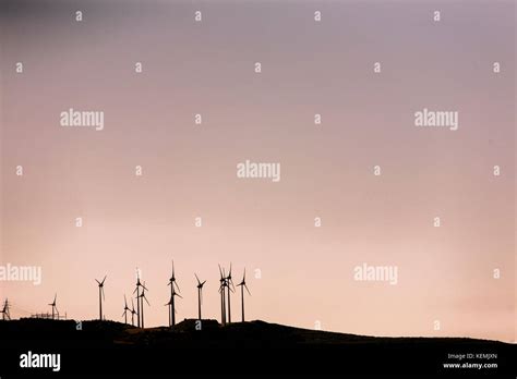 Electric wind turbine farm Stock Photo - Alamy