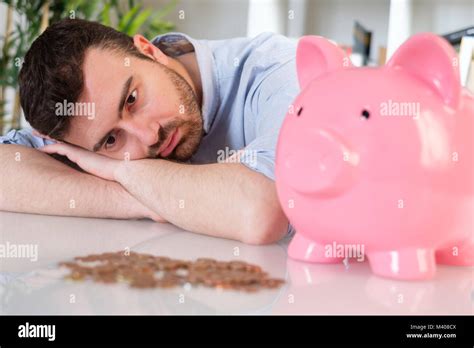 Sad man losing his savings after bad investment Stock Photo - Alamy
