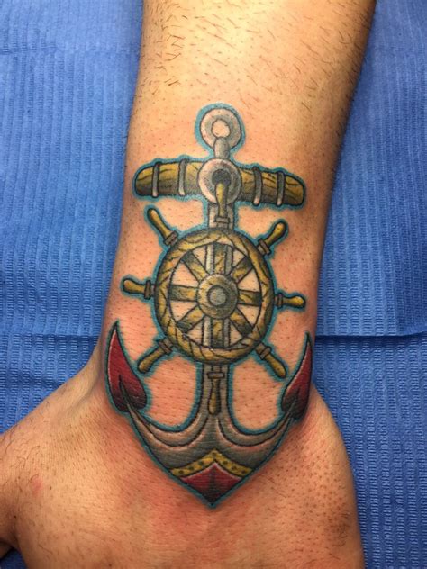 Colourful anchor with a old rudder inside | Anchor tattoos, Tattoo designs men, Nautical tattoo