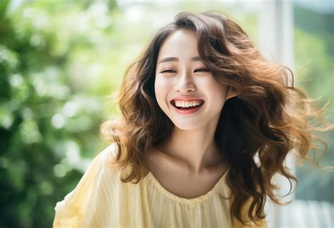 Premium AI Image | young asian woman laughing and smiling on blurred green park background