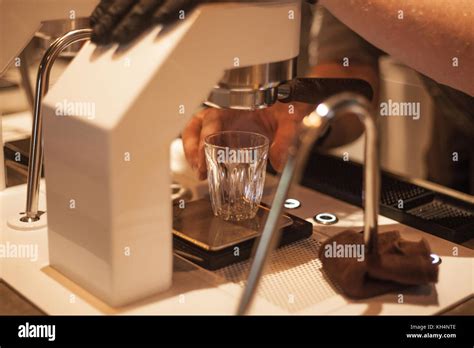 Barista Brewing Espresso Shot from Espresso Machine Stock Photo - Alamy