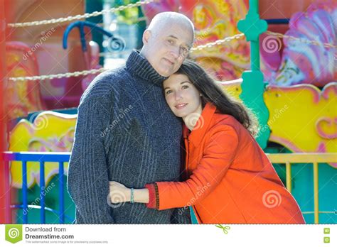 Amusement Park Outdoor Family Portrait of Hugging Adult Daughter and Senior Father Stock Image ...