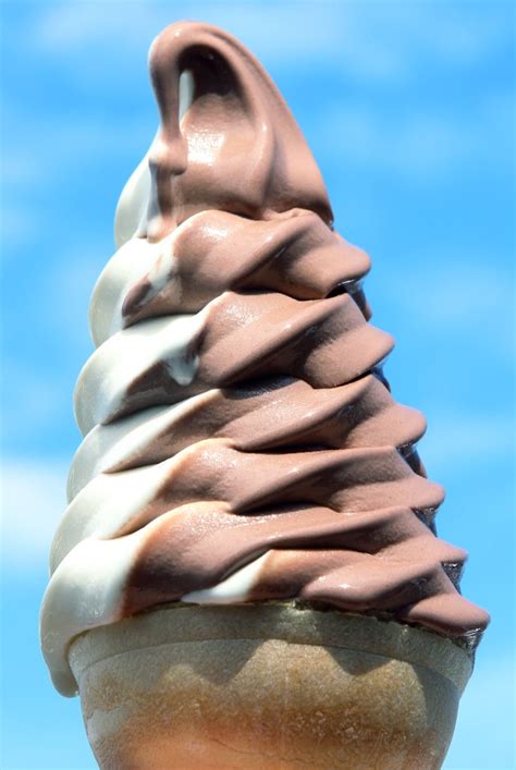 Vanilla and Chocolate Swirl Soft Serve Ice Cream Cone - Prepared Food Photos, Inc.