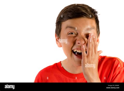 Young teenage boy isolated on white crying with laughter Stock Photo - Alamy