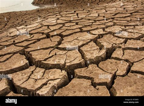 crack of dried soil background texture Stock Photo - Alamy