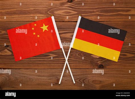 Flag of China and flag of Germany crossed with each other. The image ...