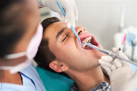 "Dental Patient Receiving An Injection Of Anesthesia From His Dentist ...