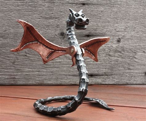 Forged baby dragon | Metal art projects, Metal sculpture, Heavy metal art