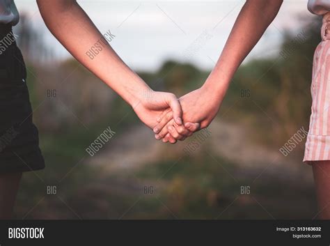 Two Girls In Love Holding Hands