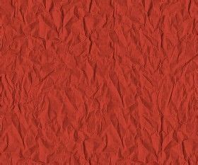 red paper textured background with small scratches on the edges and bottom corner, as if it were ...