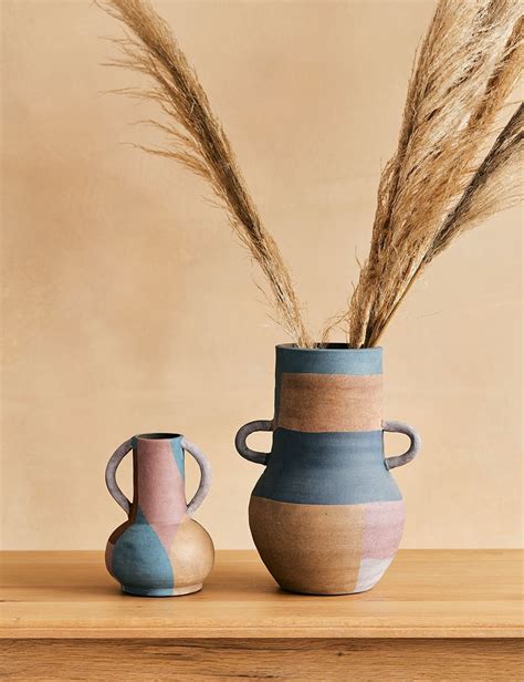 We love the rustic look of these terracotta painted vases. They look ...