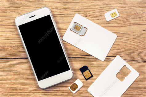 Smartphone and SIM cards - Stock Image - F021/3481 - Science Photo Library