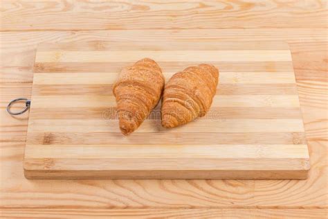 Two Puff Pastry Croissants on the Wooden Cutting Board Stock Photo - Image of flaky, product ...