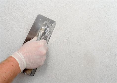 Plastering using a trowel stock photo. Image of cement - 65139586