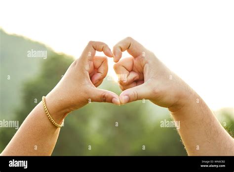 Couple heart hands close up hi-res stock photography and images - Alamy