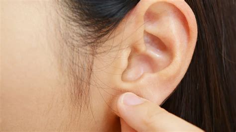 Pimple on the earlobe: Treatments, causes, and prevention