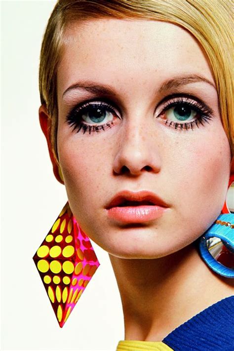 a woman with large earrings on her face and the caption says, twiggy photographer by bert stern ...