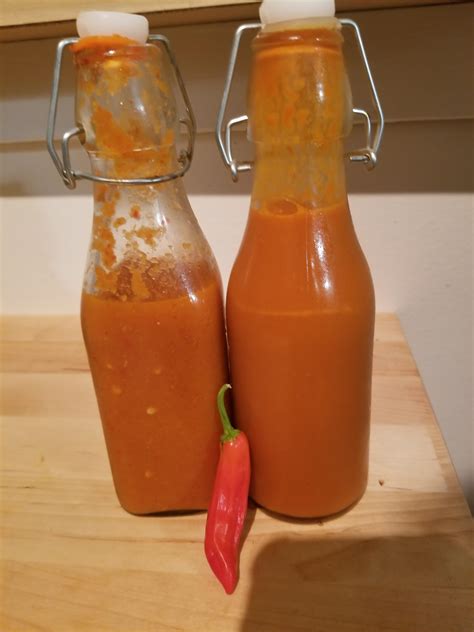 Homemade hot sauce with home growned dragon roll peppers. One chunky ...