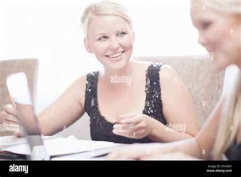 Businesswomen at conference table Stock Photo - Alamy