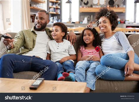 Family Sitting On Sofa Open Plan Stock Photo 670599253 | Shutterstock