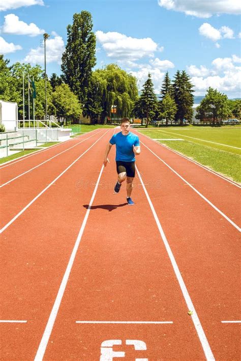 Running Fast on Athletic Field Track. Stock Photo - Image of athletic, competition: 73660646