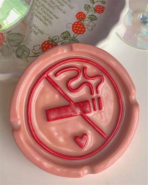 The ironic ‘no smoking’ ashtray. A pink ashtray with red detailing on the embossed no smoking ...