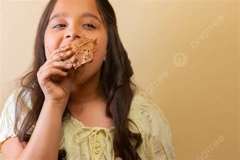 Girl Eating A Melting Chocolate Looking Away Photo Background And Picture For Free Download ...